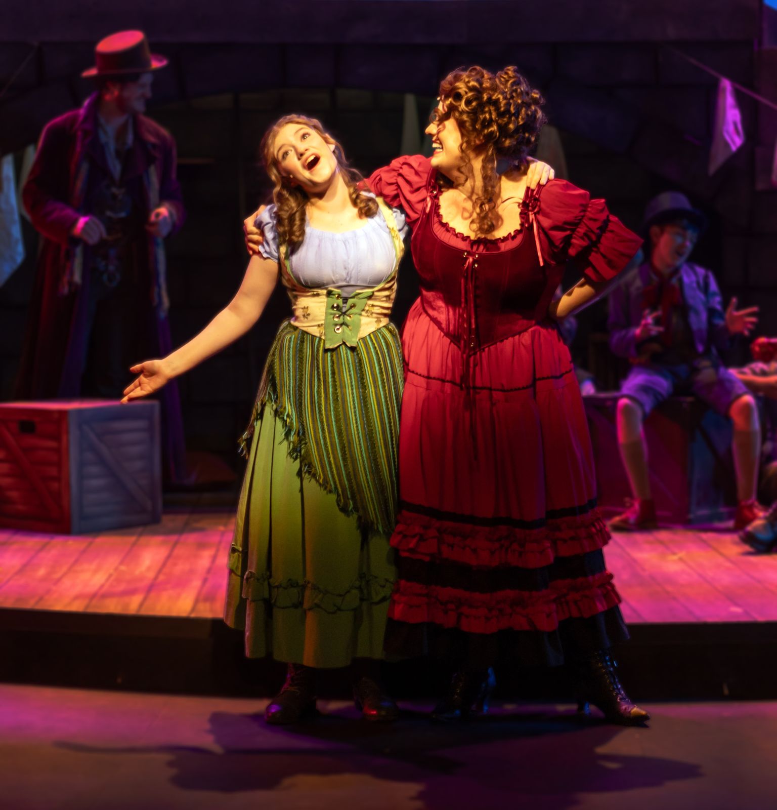 Parker Pitt as Bet beside Nancy in Oliver! at TheaterWorks