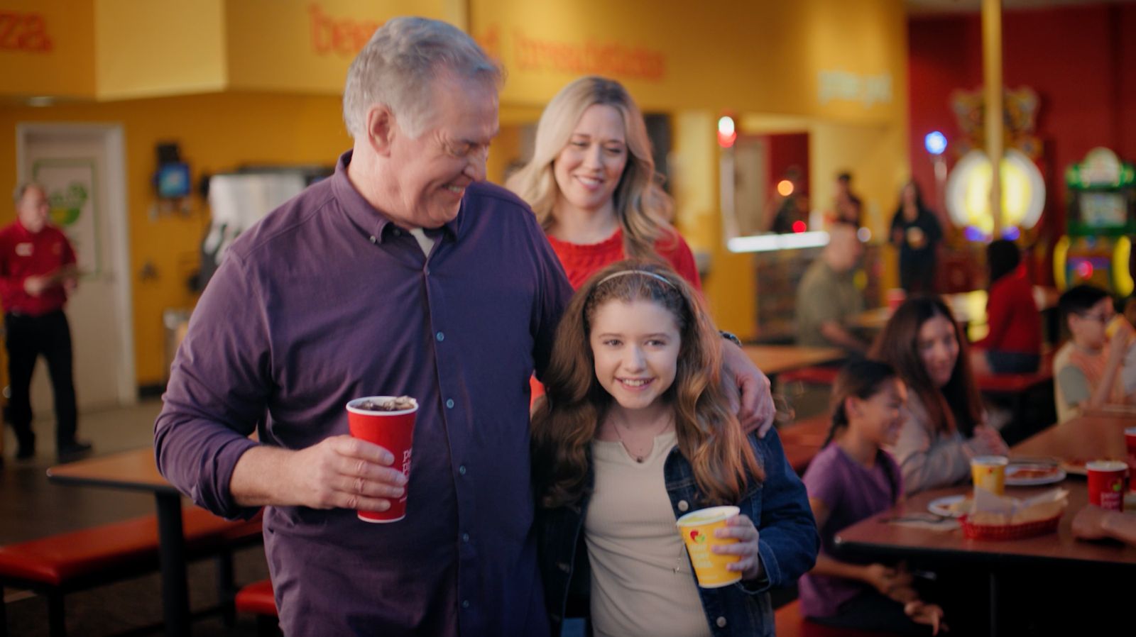 Parker Pitt with an actor playing her grandfather in a Peter Piper Pizza commercial