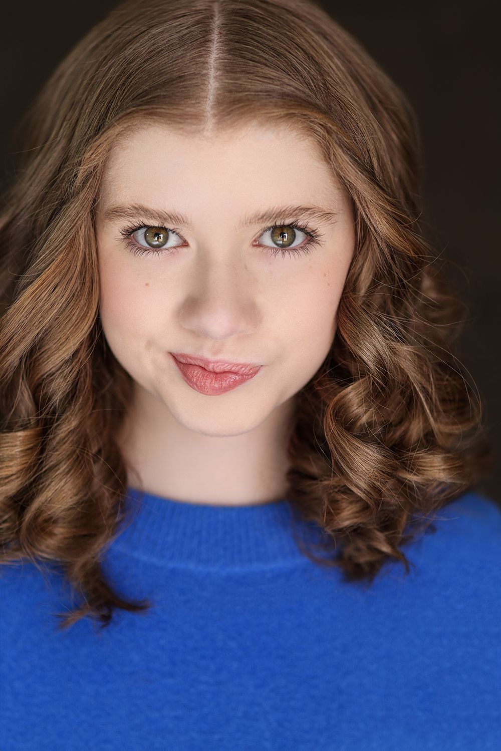 Parker Pitt, actor, headshot in a bright blue sweater by Lilly K Photography