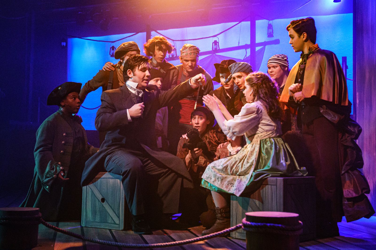 Parker Pitt as Molly Aster receiving an amulet from Lord Aster in Peter and the Starcatcher at Valley Youth Theatre