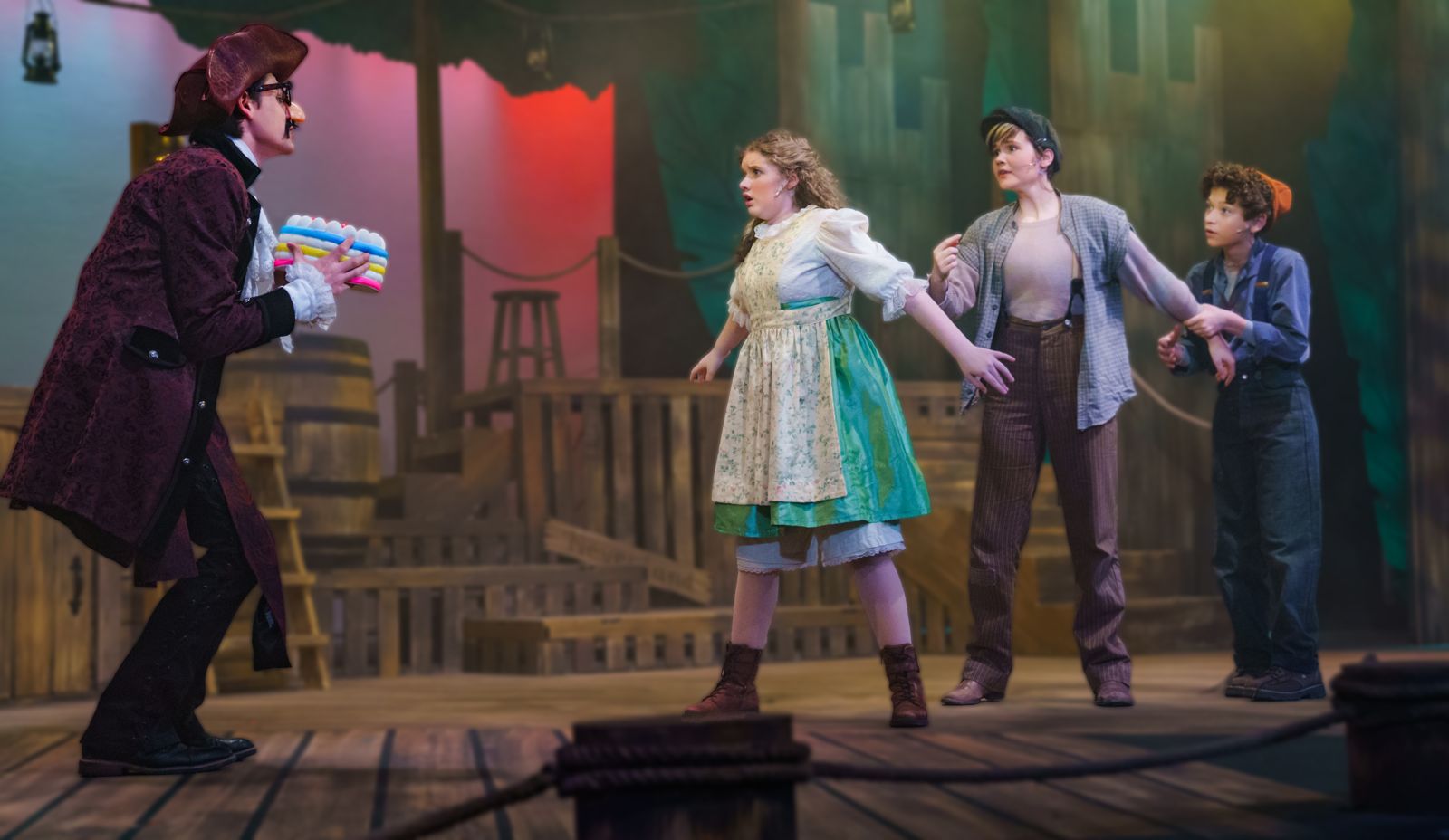 Parker Pitt as Molly Aster protecting two Lost Boys from Black Stache in Peter and the Starcatcher at Valley Youth Theatre