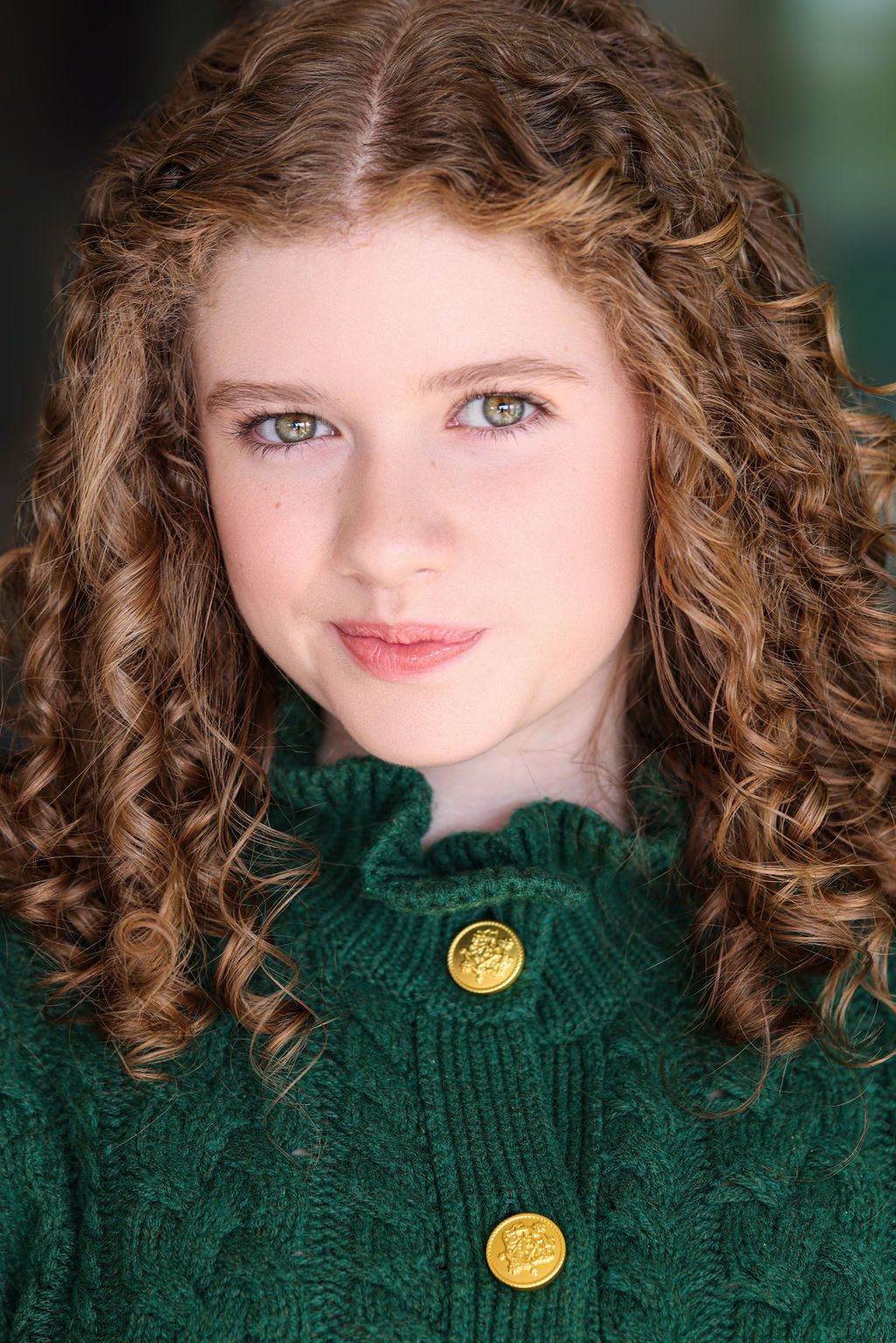 Parker Pitt, actor, headshot with curly hair in a green cardigan by Lilly K Photography