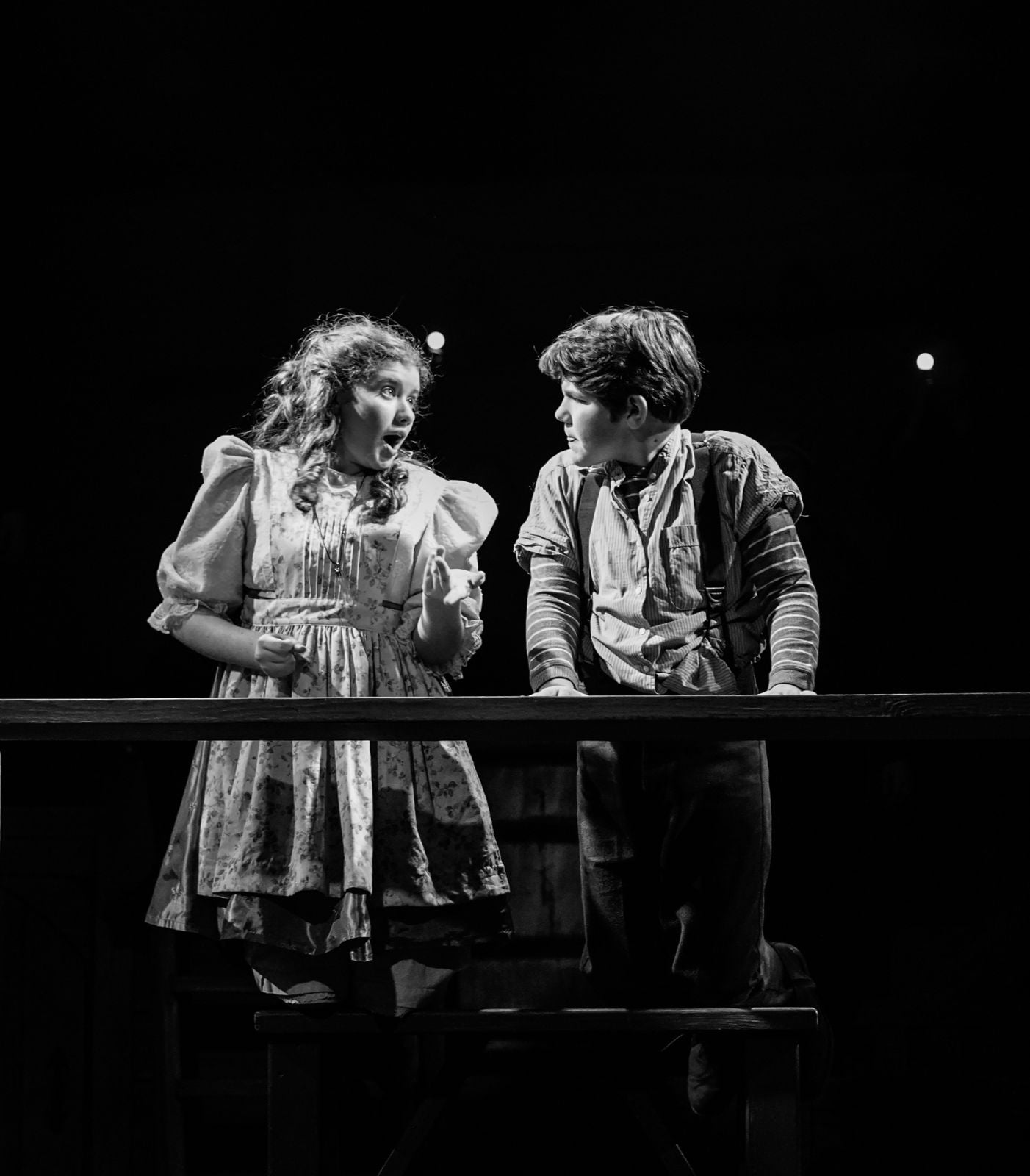 Parker Pitt as Molly Aster on the scaffolding with Peter in Peter and the Starcatcher at Valley Youth Theatre, black and white