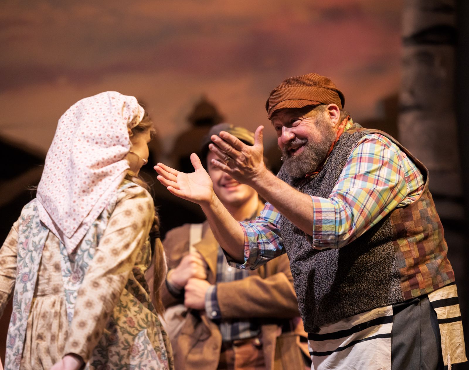 Parker Pitt as Bielke being greeted by Tevye in Fiddler on the Roof at The Phoenix Theatre Company