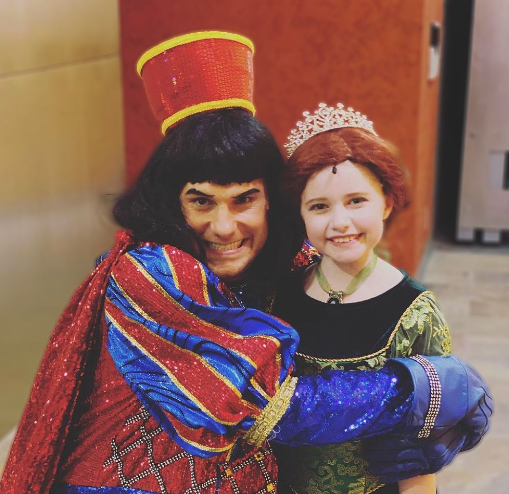 Parker Pitt as Young Fiona being hugged by Lord Farquaad in Shrek the Musical at Mesa Encore Theatre