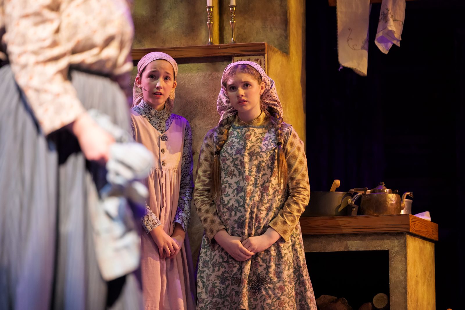 Parker Pitt as Bielke looking on with Shprintze in Fiddler on the Roof at The Phoenix Theatre Company