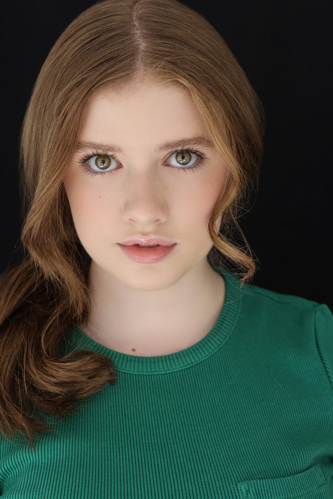 Parker Pitt, actor, 2025 headshot in a green top by Lilly K Photography