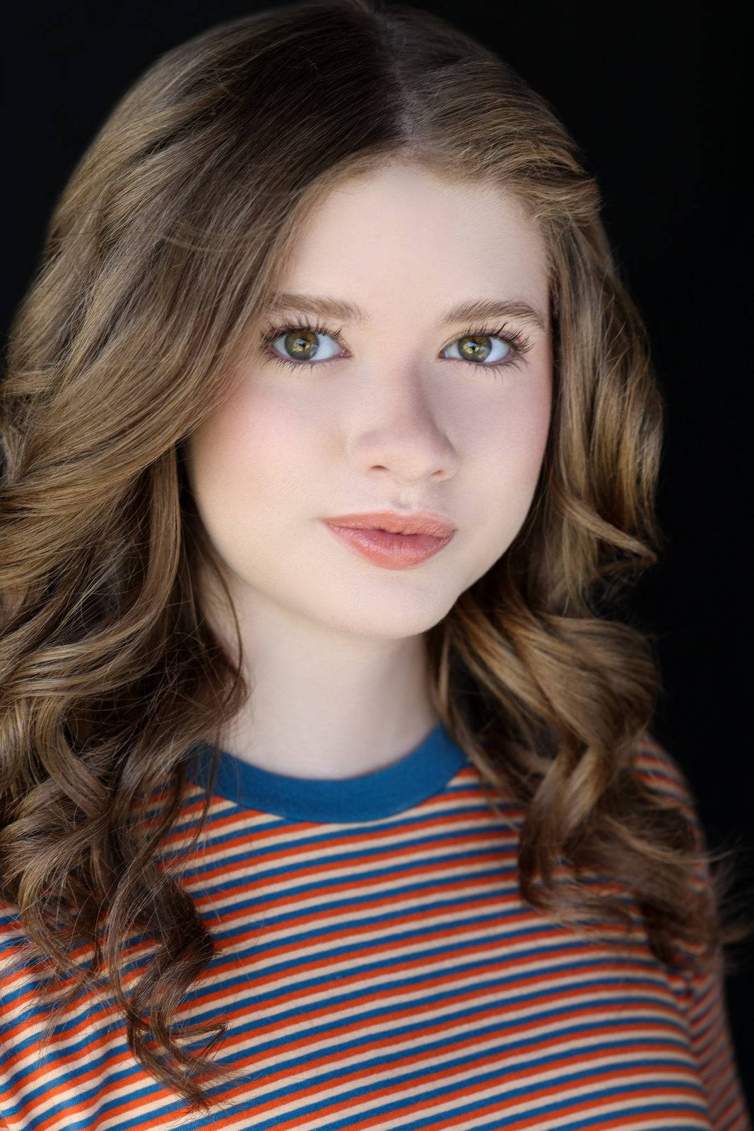 Parker Pitt, actor, 2026 headshot in a striped top by Lilly K Photography